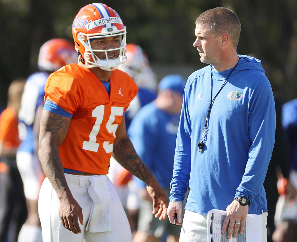 Billy Napier, head football coach at Florida, and quarterback Anthony Richardson chat March 17, 2022, during one of the Gators' spring practices. (Stephen M. Dowell/Orlando Sentinel/Tribune News Service via Getty Images)