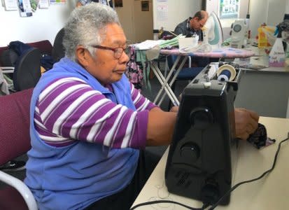 FILE PHOTO: Sister Josefa uses a sewing machine as she teaches sewing at the Compassion Soup Kitchen in Wellington, New Zealand, May 16, 2018. REUTERS/Jonathan Barrett/File Photo