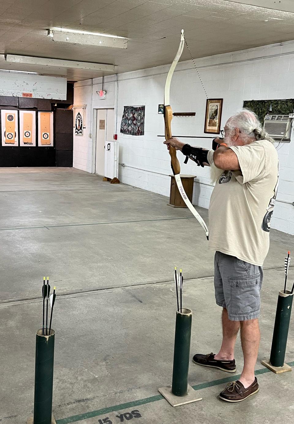  Ed Bowen readies his bow at Narragansett Bow Hunters in North Kingstown.