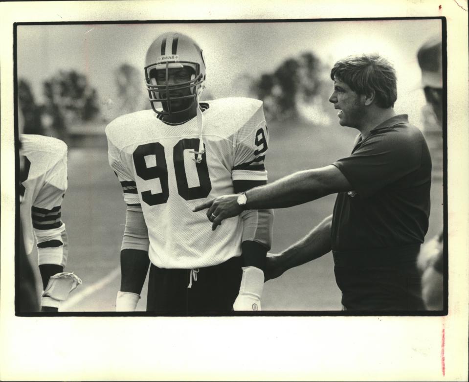 Ezra Johnson listened to instructions from John Meyer (right) in 1981.