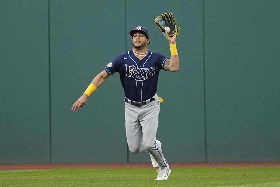 Tampa Bay Rays center fielder Jose Siri catches a fly ball hit for an out against Cleveland Guardians' Steven Kwan in the fourth inning of a baseball game Saturday, Sept. 2, 2023, in Cleveland. (AP Photo/Sue Ogrocki)