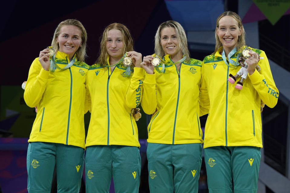 The Australian winning Women's 4 x 200m Freestyle Relay team pose with their gold medals during medal ceremony for the event at the swimming at the Commonwealth Games in Sandwell Aquatics Centre in Birmingham, England, Sunday, July 31, 2022. The team is Madison Wilson, Kiah Melverton, Mollie O'Callaghan, and Ariadne Titmus who broke the world record for the event. (AP Photo/Kirsty Wigglesworth)