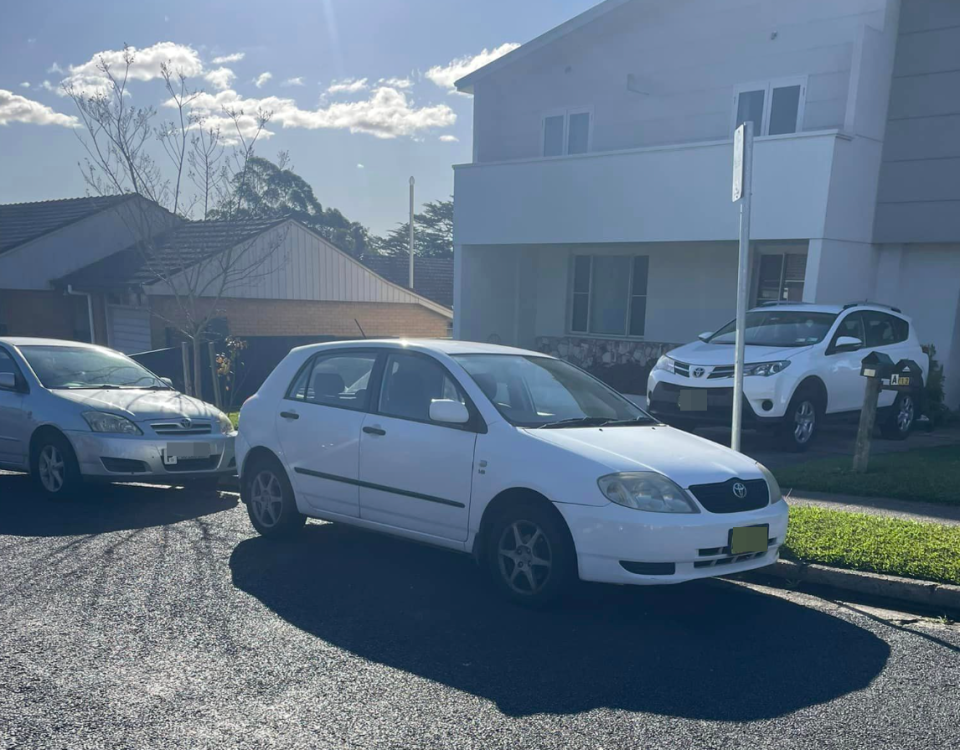 A car pictured parked across a driveway in NSW.