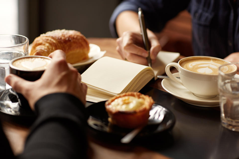 People drink coffee in a cafe.