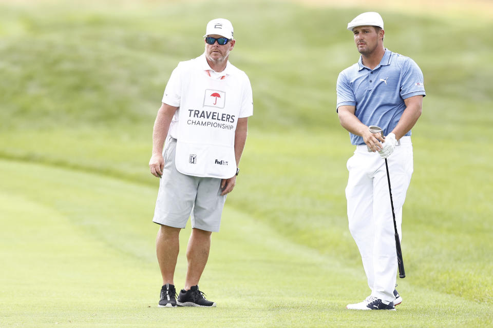 Bryson DeChambeau with his caddie Tim Tucker