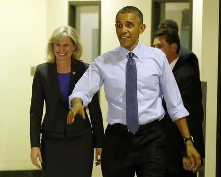 U.S. President Barack Obama walks with Democratic candidate for Wisconsin Gov. Mary Burke while at North Division High School in Milwaukee October 28, 2014. REUTERS/Larry Downing