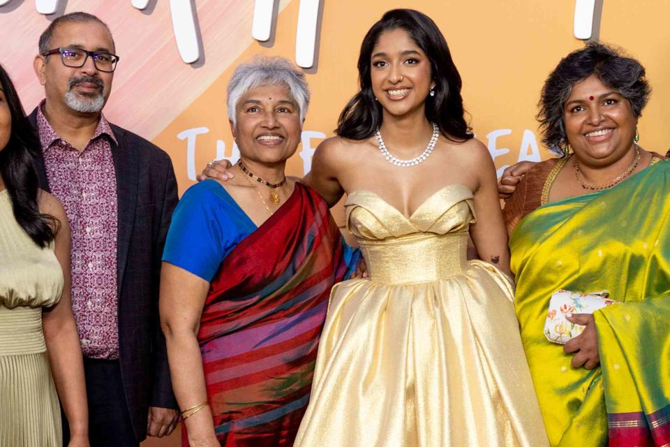 <p>Emma McIntyre/WireImage</p> Maitreyi Ramakrishnan (center) and her family attend Netflix