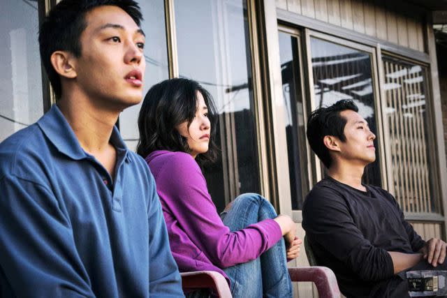 <p>Well Go USA/courtesy Everett Collection</p> Yoo Ah-In, Jeon Jong-seo, and Steven Yeun in 'Burning'