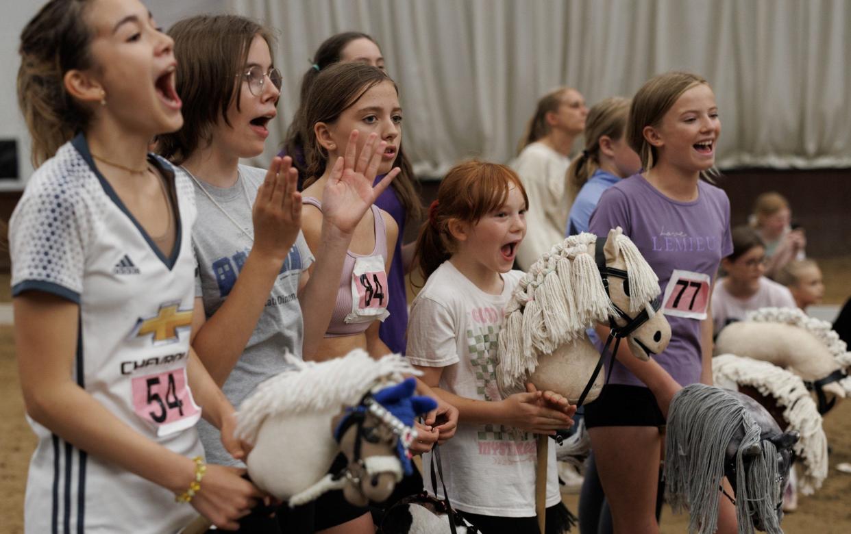 Competitors cheer on their friends