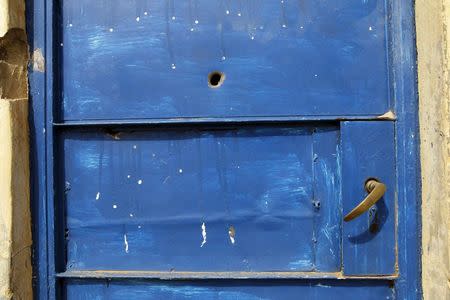 A bullet hole is seen on the door of a house in Gyallesu district after recent clashes between Shi'ites and the army in Zaria, Kaduna state, Nigeria, February 3, 2016. REUTERS/Afolabi Sotunde