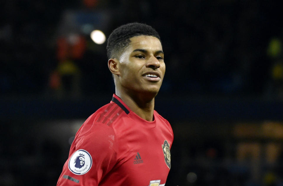 FILE - In this Saturday, Dec. 7, 2019 file photo, Manchester United's Marcus Rashford celebrates during an English Premier League soccer match against Manchester City at Etihad stadium in Manchester, England. British Prime Minister Boris Johnson faced growing pressure Tuesday, June 16, 2020 to make a policy U-turn as opponents and allies alike rallied behind a young soccer star’s campaign to help families struggling with food poverty. Manchester United and England player Marcus Rashford is urging the government to provide free meals for needy students over the summer holidays.(AP Photo/Rui Vieira, file)