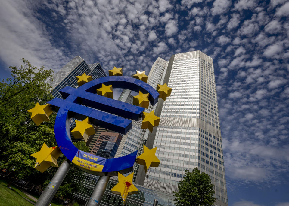 The Euro sculpture stands in front of the former European Central Bank in Frankfurt, Germany, Wednesday, July 13, 2022. The euro on Tuesday fell to parity with the dollar for the first time in nearly 20 years. (AP Photo/Michael Probst)