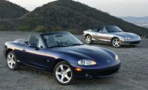 <p>Mazda goes bonkers with special-edition MX-5 Miatas for 2003, introducing three: the Special Edition, the Shinsen Version, and the Club Sport package. The first two are pictured above (the blue model is the SE, and the gray one is the Shinsen). Special five-spoke 16-inch wheels, Strato Blue Mica paint, and a gray interior and top distinguish the SE, while the Shinsen is styled the opposite, with Titanium Gray metallic paint and a blue top and interior. The Club Sport package is extremely rare: Only 50 cars are made, all of them intended for racing. None comes with a radio, air conditioning, or power steering; a hardtop is available. </p>