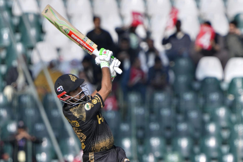 Peshawar Zalmi' Babar Azam plays a shot during the Pakistan Super League T20 cricket match between Peshawar Zalmi and Karachi Kinds, in Lahore, Pakistan Wednesday, Feb. 21, 2024. (AP Photo/K.M. Chaudary)