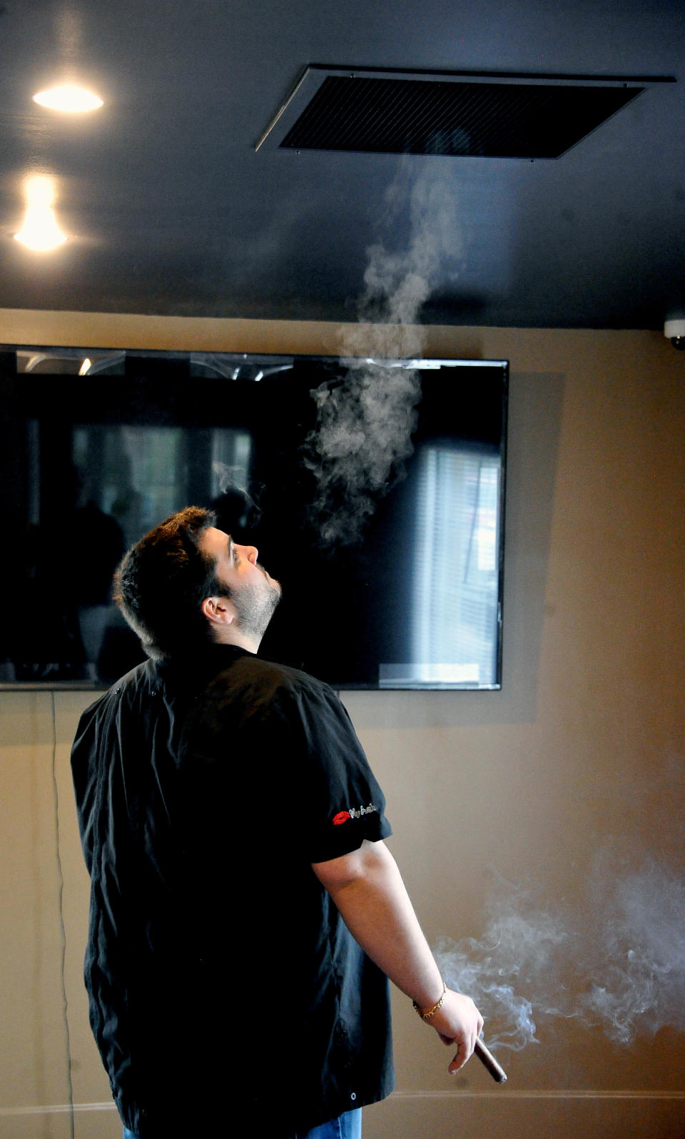 MIchael Heidelman demonstrates the ventilation system at The Cigar Vault.