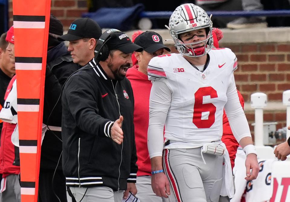 Ohio State coach Ryan Day talks to quarterback Kyle McCord during Saturday's game.