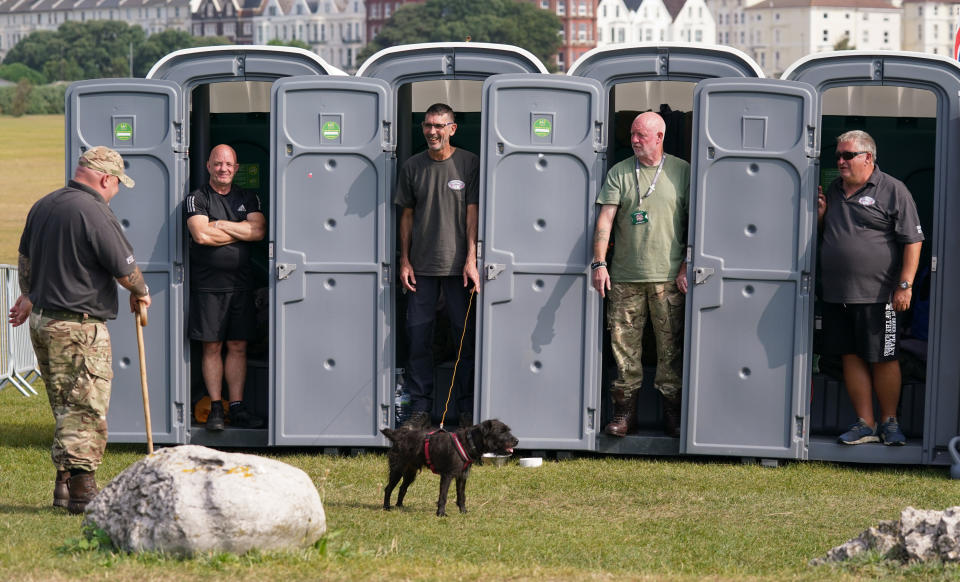 <p>Forgotten Veterans UK founder Gary Weaving (far left) chats with veterans (from 2nd left to right) Ian Baillie, Mike Hewlett, Gary Sprakes and Chris Nicholls, who are spending 120 hours in portable toilet cabins on Southsea Common in Portsmouth, Hampshire, to raise money for Forgotten Veterans UK which supports former members of the armed forces. The Veterans from the Army and the Royal Navy Submarine service, who are aiming to raise �1,500, began their sit-in on Wednesday and will finish at 4pm on Sunday. Picture date: Thursday September 16, 2021.</p>
