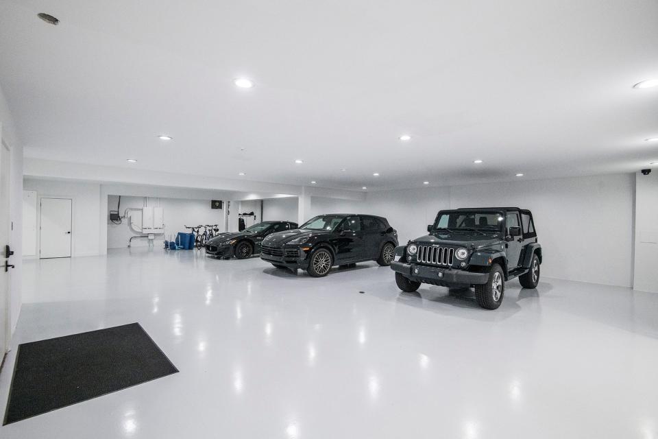The state-of-the-art garage includes an electric vehicle charging station.