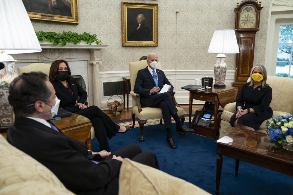 President Joe Biden speaks during a meeting with a bipartisan group of mayors and governors to discuss a coronavirus relief package, in the Oval Office of the White House, Friday, Feb. 12, 2021, in Washington. From left, Gov. Andrew Cuomo, D-N.Y., Vice President Kamala Harris, Biden, and Gov. Michelle Lujan Grisham, D-N.M. (AP Photo/Evan Vucci)