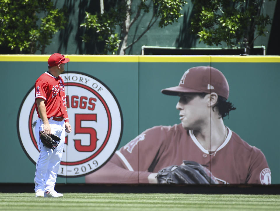 ANAHEIM, CA - JULY 28: Los Angeles Angels Center field Mike Trout (27) looks toward the Tyler Skaggs Memorial during a game against the Oriole on July 28, 2019, at Angel Stadium of Anaheim in Anaheim, CA.   (Photo by Carrie Giordano (Jesenovec)/Icon Sportswire via Getty Images)