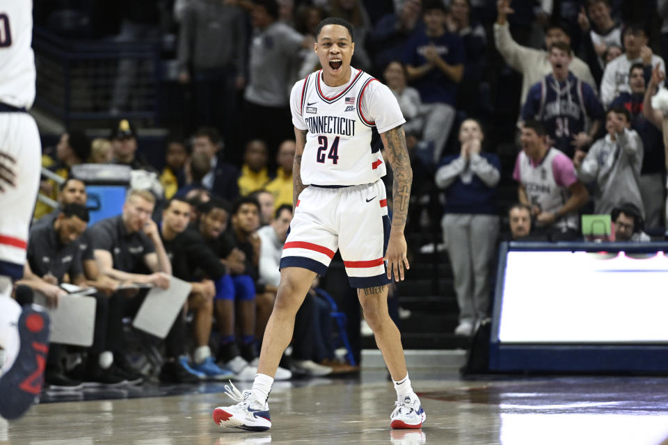 UConn's Jordan Hawkins (24) reacts after making a 3-point basket in the second half of an NCAA college basketball game against Seton Hall, Saturday, Feb. 18, 2023, in Storrs, Conn. (AP Photo/Jessica Hill)