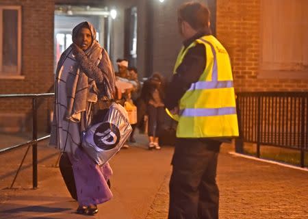 Residents are evacuated from the Taplow Tower residential block as a precautionary measure following concerns over the type of cladding used on the outside of the building on the Chalcots Estate in north London, Britain, June 23, 2017. REUTERS/Hannah McKay