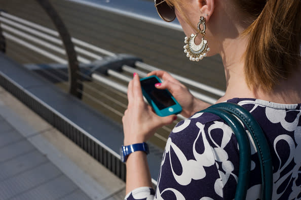 A young woman is making money from her Tinder matches. Photo from Getty Images.