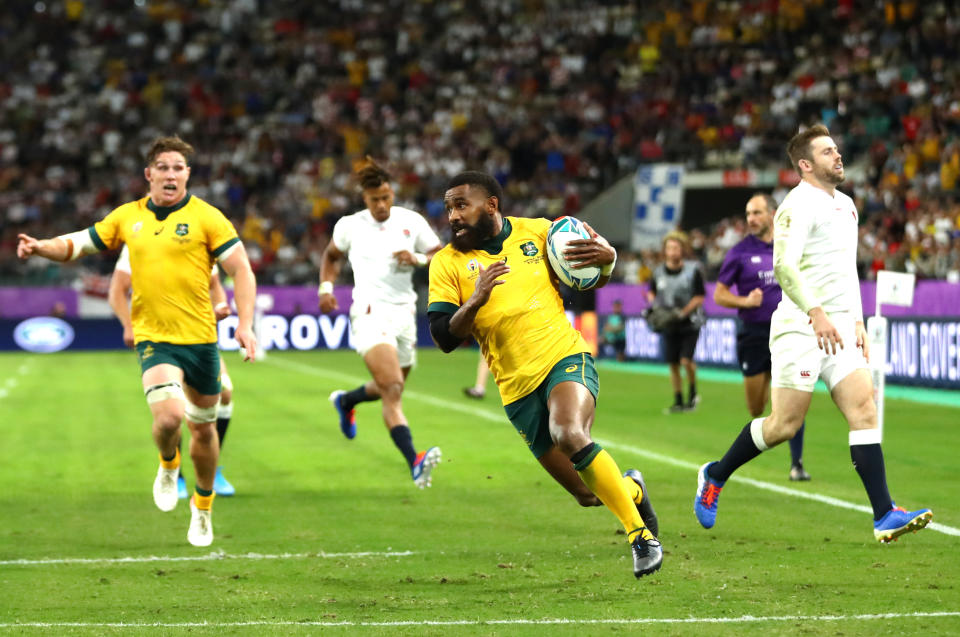 OITA, JAPAN - OCTOBER 19:  Marika Koroibete of Australia crosses to score his team's first try as Owen Farrell of England runs in during the Rugby World Cup 2019 Quarter Final match between England and Australia at Oita Stadium on October 19, 2019 in Oita, Japan. (Photo by Michael Steele/Getty Images)