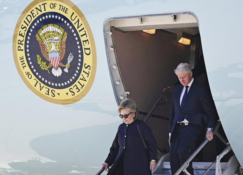 Former President Bill Clinton and former Secretary of State Hillary Clinton disembark Air Force One at Dobbins Air Reserve Base in Marietta, Ga., on Nov. 28, 2023, to attend services for former first lady Rosalynn Carter. (Anbdrew Caballero-Reynolds / AFP - Getty Images)