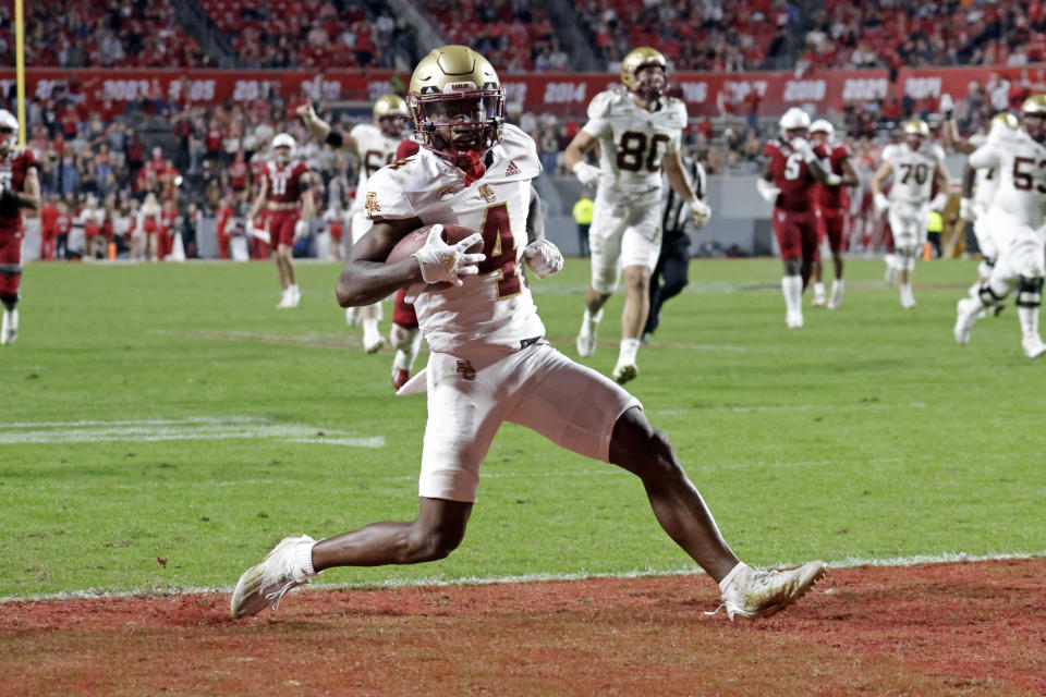Boston College wide receiver Zay Flowers (4) struts into the end zone as he scores a touchdown against North Carolina State during the second half of an NCAA college football game Saturday, Nov. 12, 2022, in Raleigh, N.C. (AP Photo/Chris Seward)
