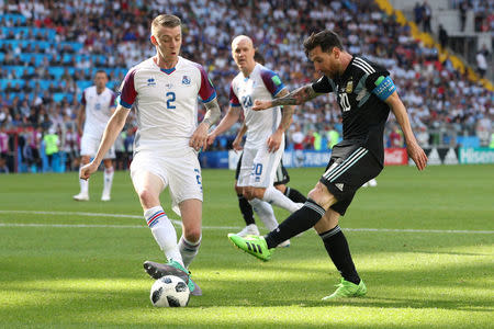 Soccer Football - World Cup - Group D - Argentina vs Iceland - Spartak Stadium, Moscow, Russia - June 16, 2018 Argentina's Lionel Messi in action with Iceland's Birkir Mar Saevarsson REUTERS/Albert Gea