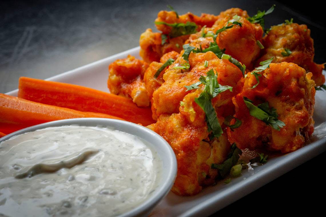 Veg Cafe’s popular buffalo momo cauliflower is served, Thursday, Sept. 19, 2019.