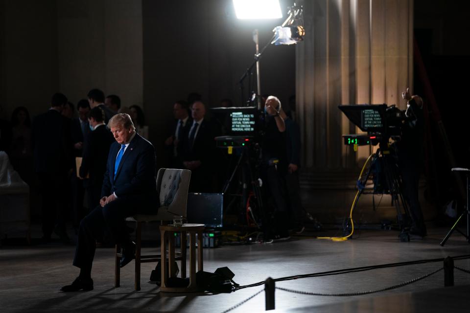 <p>File Image: In this 3 May, 2020, file photo President Donald Trump waits for a segment to start during a Fox News virtual town hall from the Lincoln Memorial in Washington. </p> (AP)