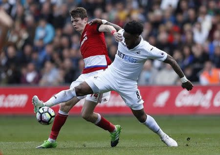 Britain Football Soccer - Swansea City v Middlesbrough - Premier League - Liberty Stadium - 2/4/17 Middlesbrough's Marten de Roon in action with Swansea City's Leroy Fer Action Images via Reuters / Andrew Boyers Livepic EDITORIAL USE ONLY. No use with unauthorized audio, video, data, fixture lists, club/league logos or "live" services. Online in-match use limited to 45 images, no video emulation. No use in betting, games or single club/league/player publications. Please contact your account representative for further details. - RTX33Q9H