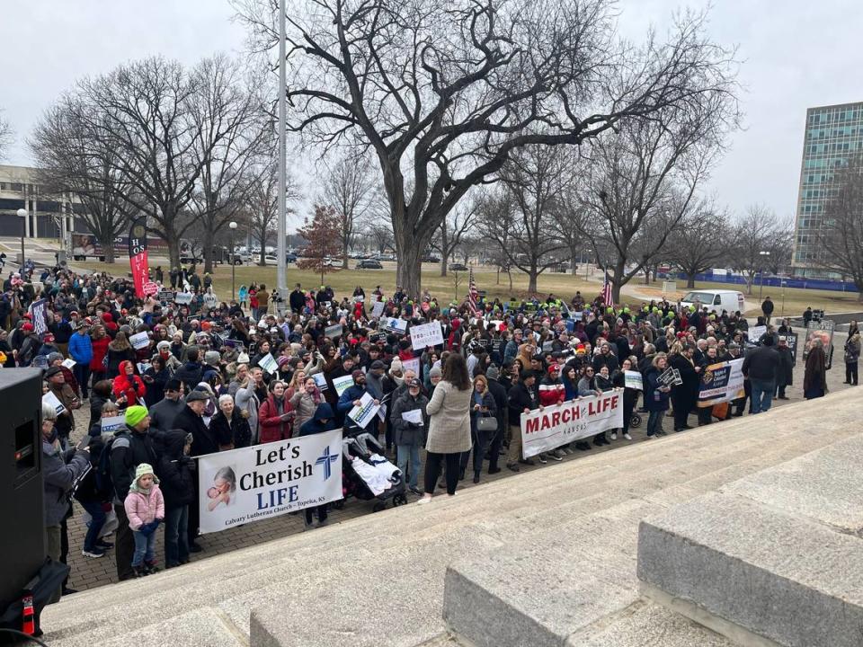 Anti-abortion activists gather at the steps of the Kansas State Capitol Tuesday.