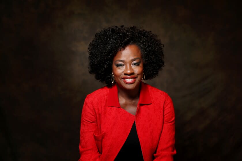 Viola Davis in a bright red jacket