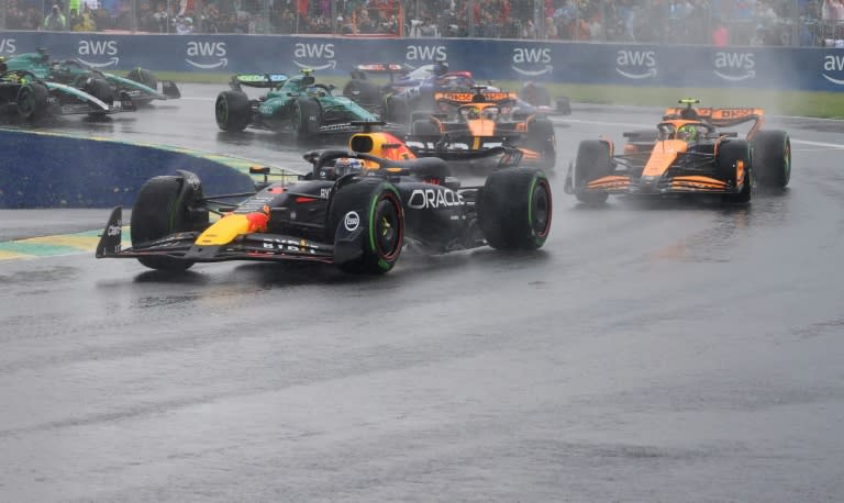 Max Verstappen leads Lando Norris as the spray flies at the Canadian Grand Prix (CHARLY TRIBALLEAU)
