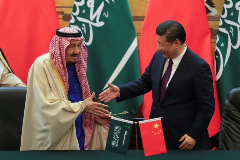 China's President Xi Jinping (right) and Saudi King Salman bin Abdulaziz signed 14 memoranda of understanding during a ceremony at the Great Hall of the People in Beijing, on March 16, 2017