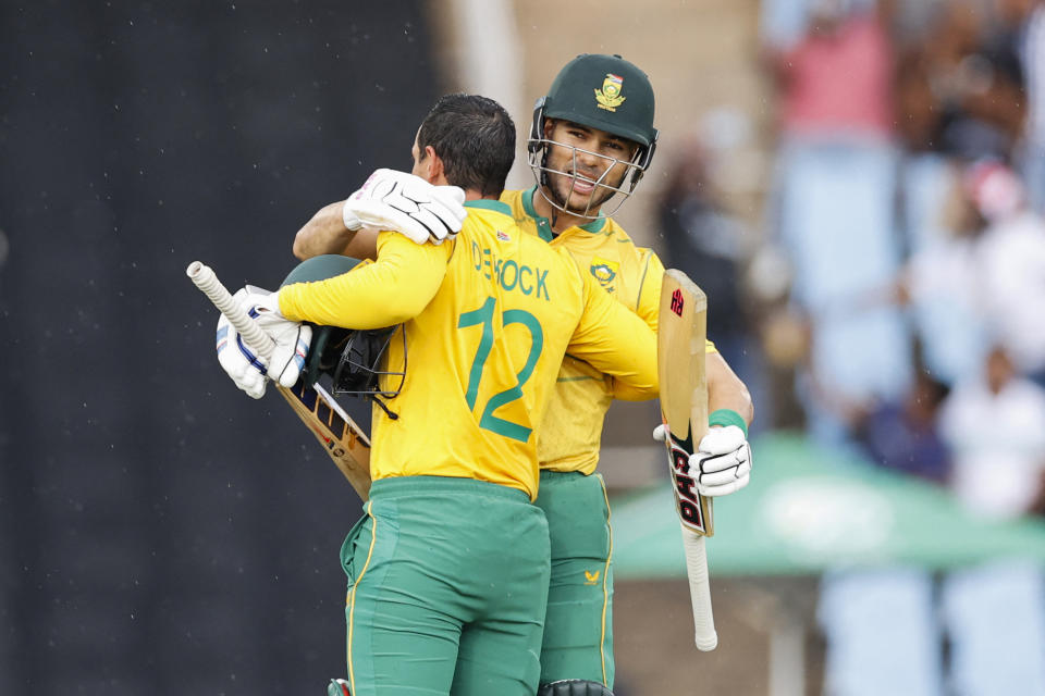 Left to right, South Africa's Quinton de Kock is congratulated by South Africa's Reeza Hendricks.