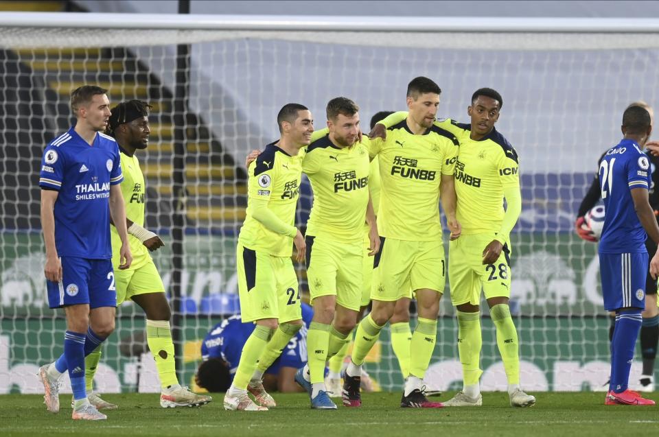 Newcastle's players celebrate after scoring their side's second goal during the English Premier League soccer match between Leicester City and Newcastle United at the King Power Stadium in Leicester, England, Friday, May 7, 2021. (Michael Regan/Pool via AP)