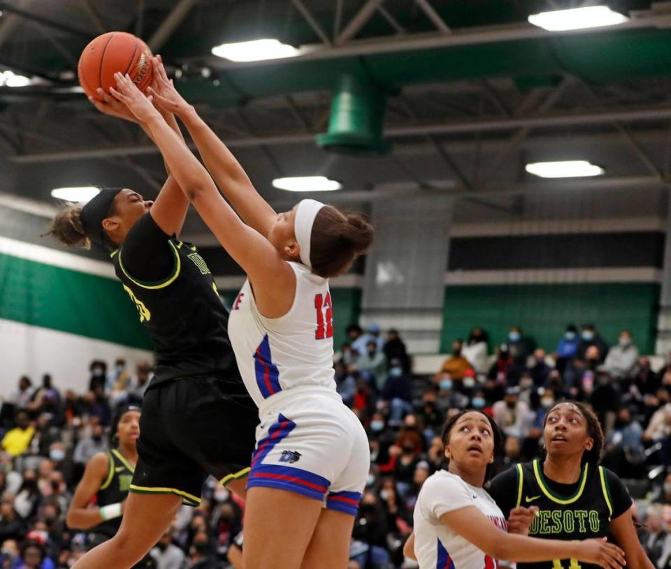 Duncanville point Zaria Rufus (12) denies DeSoto guard Kendall Brown (23) during the first half of the 6A Region II Regional Final basketball game at Waxahachie High School in Waxahachie, Texas, Tuesday, March 02, 2021. DeSoto led 24-19 at the half. (Special to the Star-Telegram Bob Booth)