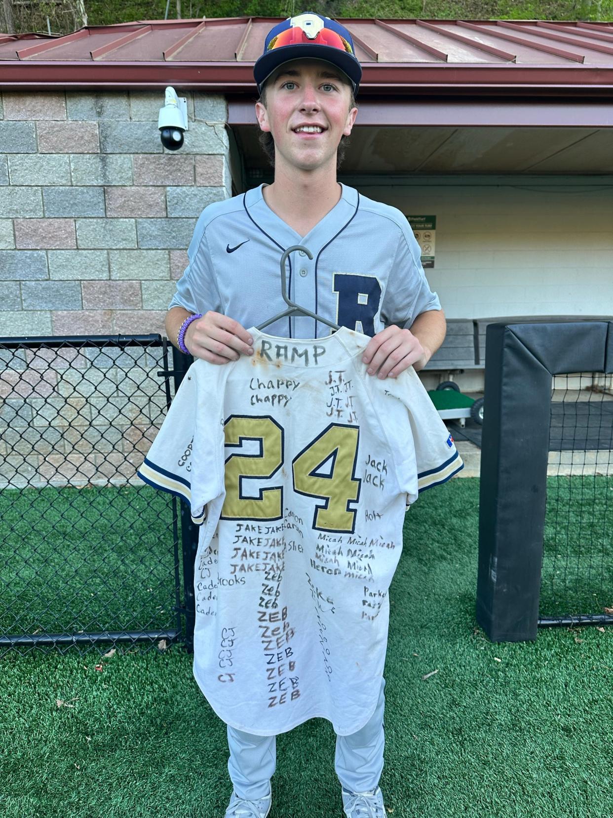 Junior Micah Simpson holds Roberson baseball's RAMP jersey after being selected as one of the team's players of the game on May 1, 2024.