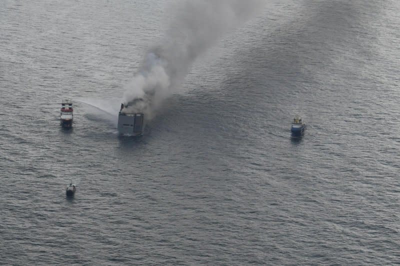 Two vessels, the Guardian and Nordic, tried to cool the side of the ship, located about 17 miles north of Ameland, with fire extinguishers but had not been successful in putting out the blaze as of early Wednesday afternoon. Photo courtesy Netherlands Coast Guard