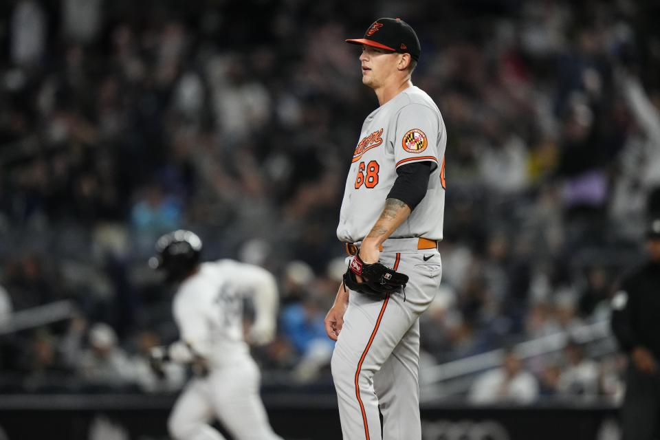 Baltimore Orioles starting pitcher Tyler Wells waits as New York Yankees' Gleyber Torres (25) runs the bases after hitting a home run during the fifth inning of a baseball game Wednesday, May 24, 2023, in New York. (AP Photo/Frank Franklin II)