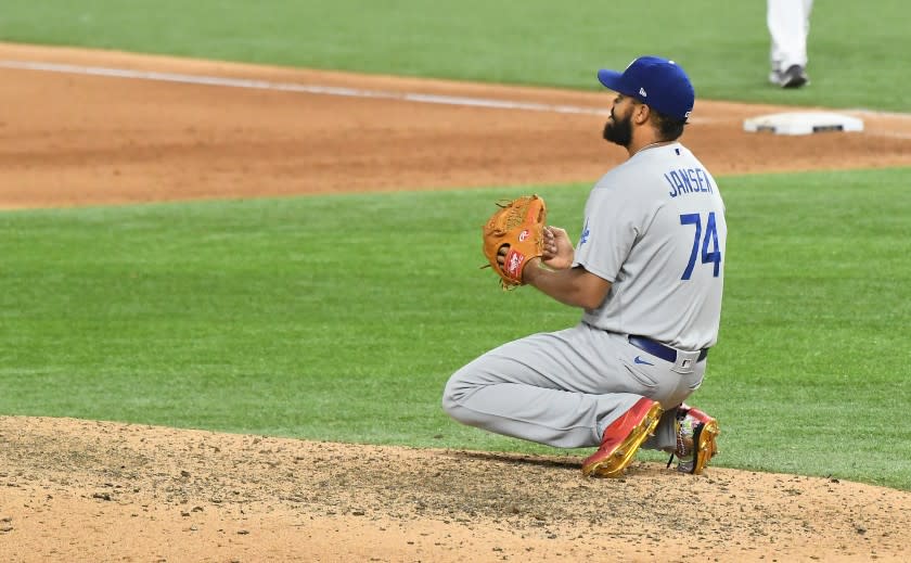 The Dodgers' Kenley Jansen drops to his knees after giving up a walk-off single in Game 4 of the World Series.