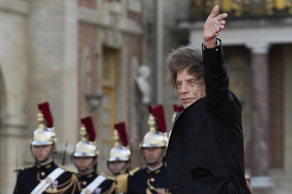 Mick Jagger arrives for a state dinner held in honor of King Charles III and Queen Camilla, at the Chateau de Versailles, west of Paris, Wednesday, Sept. 20, 2023. King Charles III of the United Kingdom starts a three-day state visit to France on Wednesday meant to highlight the friendship between the two nations with great pomp, after the trip was postponed in March amid widespread demonstrations against President Emmanuel Macron's pension changes. (AP Photo/Christophe Ena)