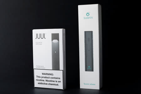 Electronic cigarette devices made by JUUL (L) and Suorin are shown in this picture illustration taken September 14, 2018. REUTERS/Mike Blake/Illustration