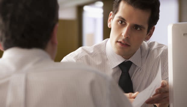 Young  Businessman going over report with older colleague