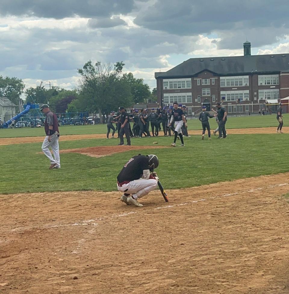 The Cherry Hill West baseball team celebrates in the background after the Lions knocked off defending Diamond Classic champion and top-ranked Gloucester Catholic, 2-0, in Saturday's semifinal round.