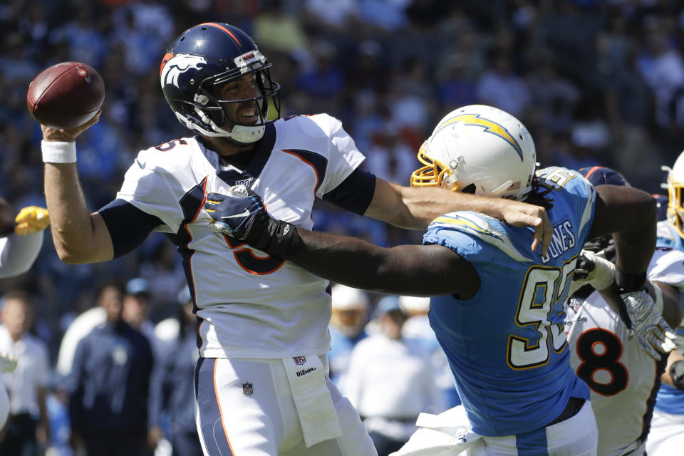 Denver Broncos quarterback Joe Flacco passes under pressure from Los Angeles Chargers defensive tackle Justin Jones during the first half of an NFL football game Sunday, Oct. 6, 2019, in Carson, Calif. (AP Photo/Alex Gallardo)